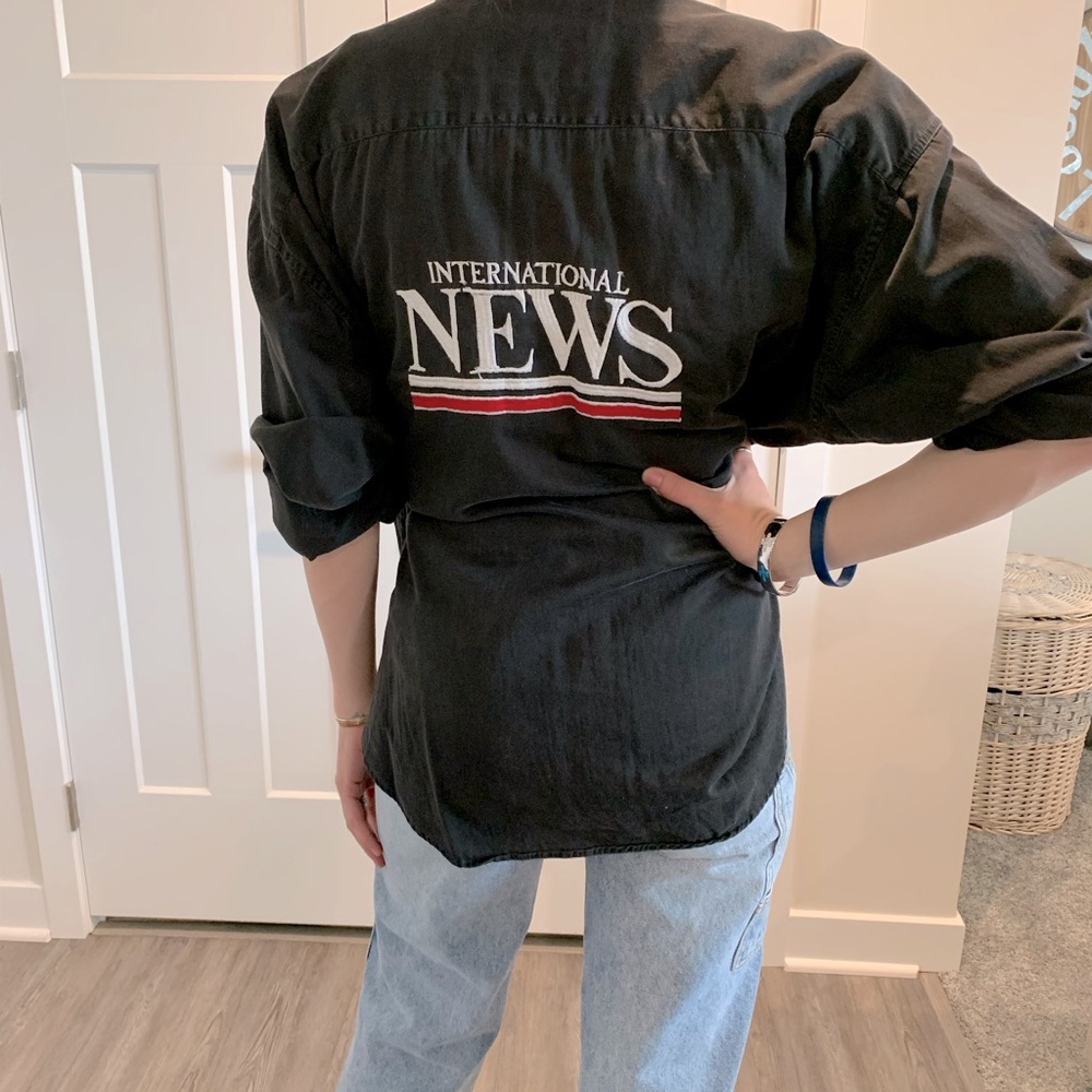 International news button up